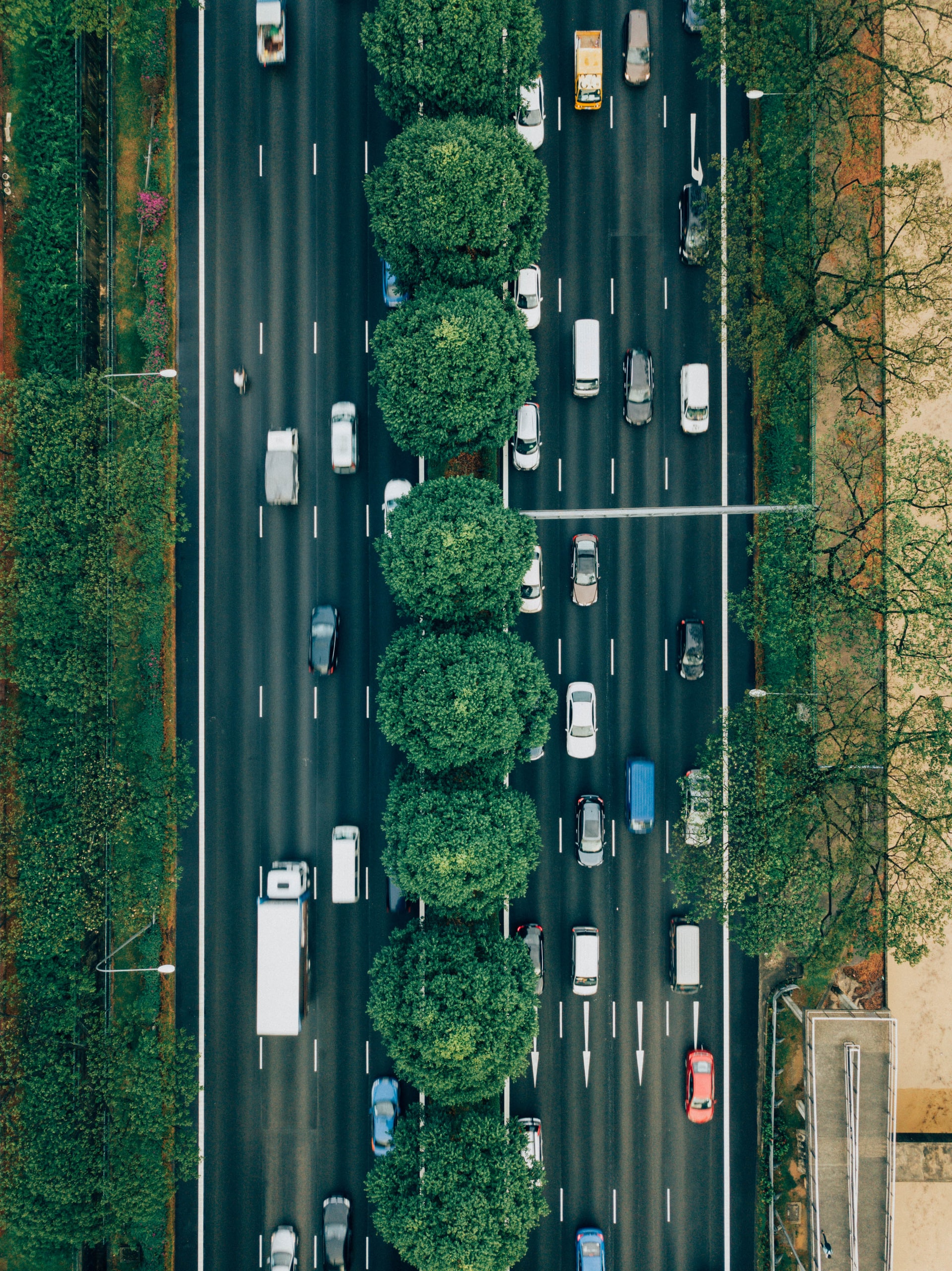  Image of traffic on a highway - Photo by CHUTTERSNAP on Unsplash